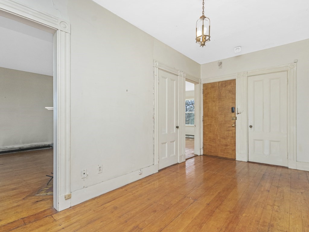 90 Addington Road, Unit 2 Brookline, MA 02445 - Photo 20 of 41 a view of an empty room with wooden floor