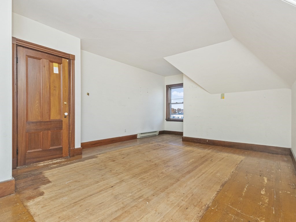 90 Addington Road, Unit 2 Brookline, MA 02445 - Photo 24 of 41 an empty room with windows and closet