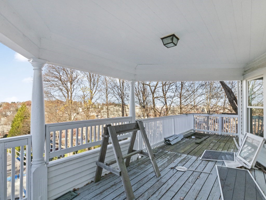 90 Addington Road, Unit 2 Brookline, MA 02445 - Photo 35 of 41 a porch with wooden floor view