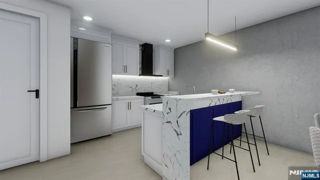 a kitchen with a refrigerator a sink and cabinets