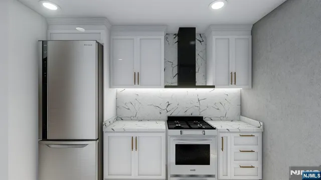 a kitchen with a stove and a refrigerator