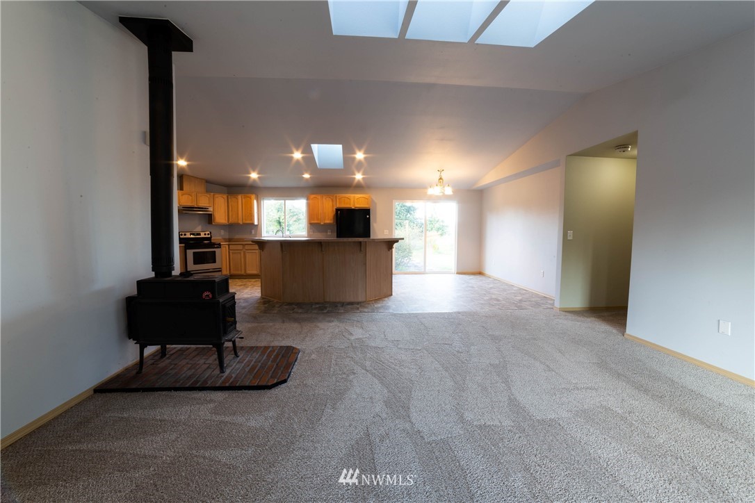 14724 Mima Road Southwest Olympia, WA 98512 - Photo 2 of 14 a living room with furniture and a flat screen tv