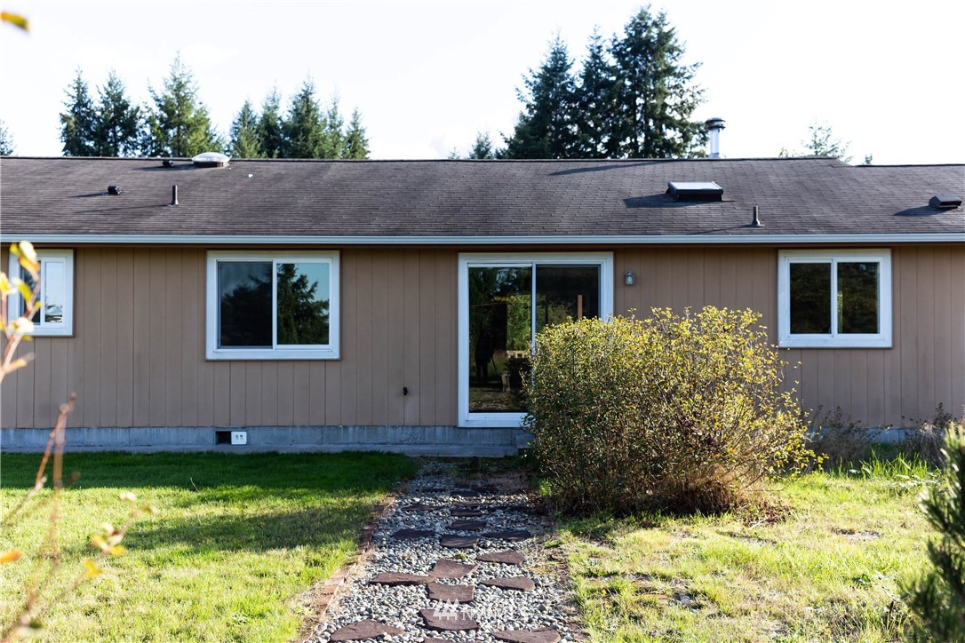 14724 Mima Road Southwest Olympia, WA 98512 - Photo 13 of 14 a view of a house with backyard and garden
