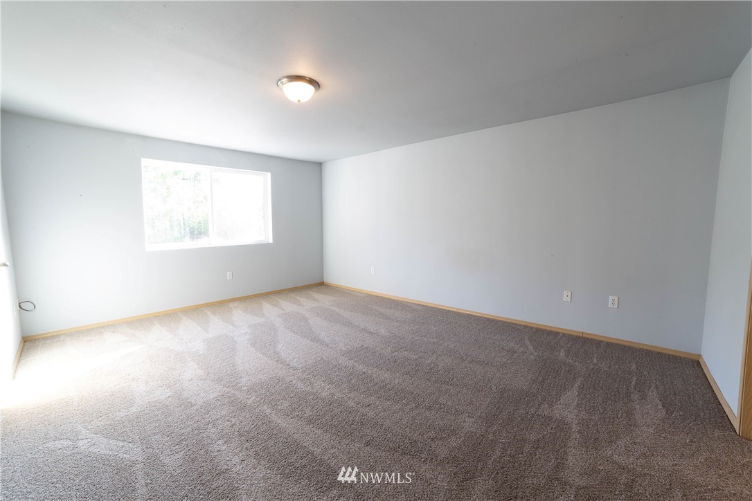14724 Mima Road Southwest Olympia, WA 98512 - Photo 7 of 14 an empty room with a window