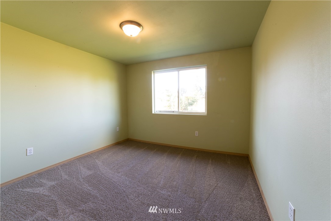 14724 Mima Road Southwest Olympia, WA 98512 - Photo 9 of 14 an empty room with windows