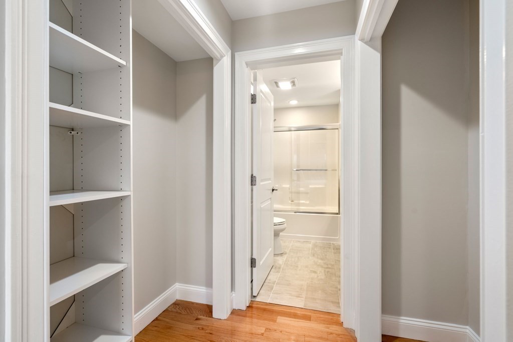 375 Border Street, Unit 375 Boston, MA 02128 - Photo 18 of 34 a view of closet with wooden floor