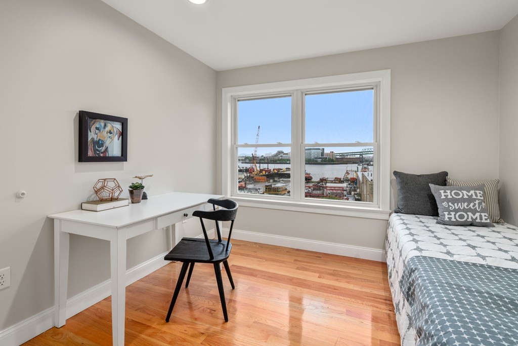375 Border Street, Unit 375 Boston, MA 02128 - Photo 19 of 34 a living room with a couch and a large window