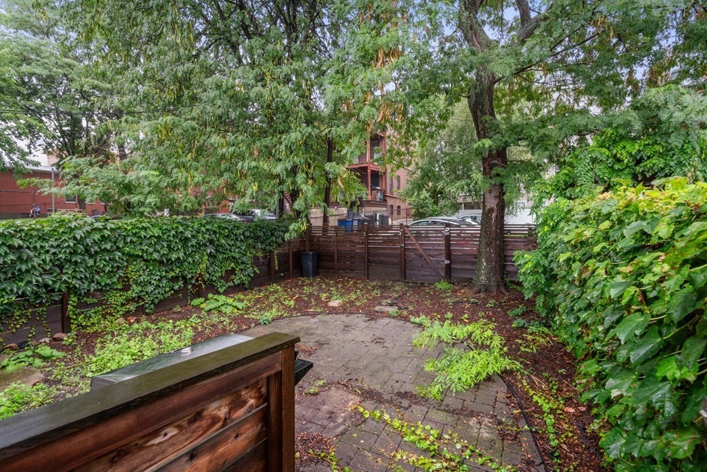 375 Border Street, Unit 375 Boston, MA 02128 - Photo 32 of 34 a backyard of a house with lots of green space