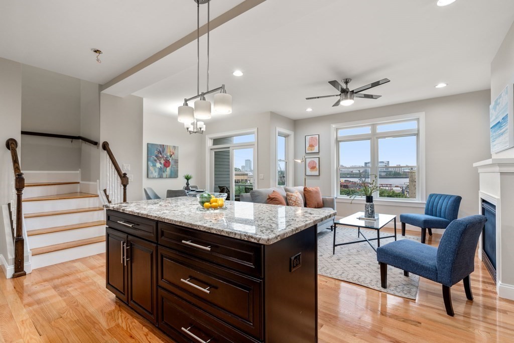 375 Border Street, Unit 375 Boston, MA 02128 - Photo 4 of 34 a view of kitchen island dining area kitchen island and stainless steel appliances