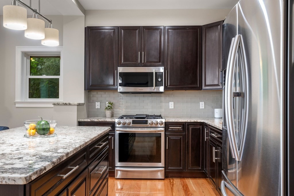 375 Border Street, Unit 375 Boston, MA 02128 - Photo 7 of 34 a kitchen with a stove and a microwave