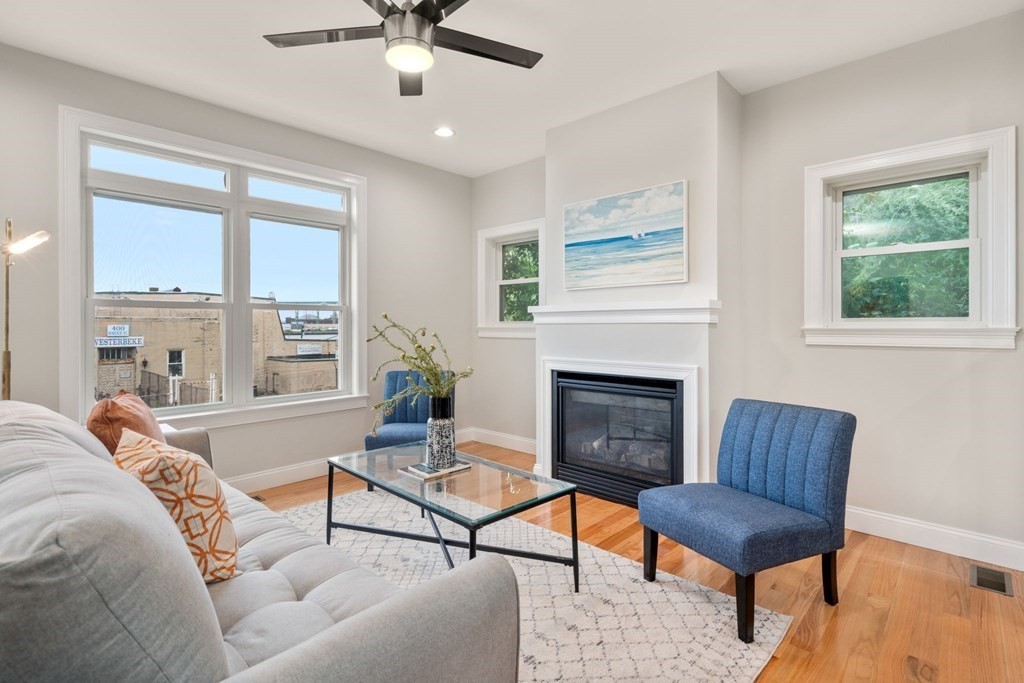 375 Border Street, Unit 375 Boston, MA 02128 - Photo 9 of 34 a living room with furniture fireplace and window