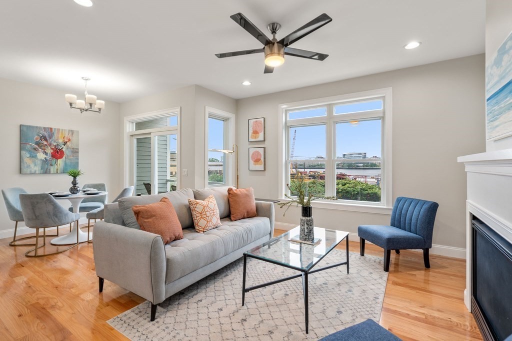 375 Border Street, Unit 375 Boston, MA 02128 - Photo 10 of 34 a living room with furniture and a large window