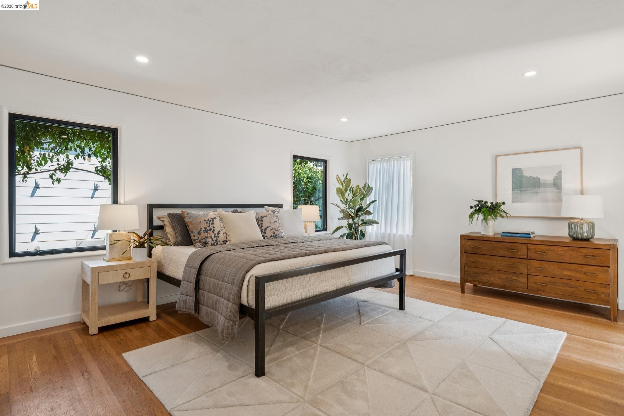 38 Highgate Road Kensington, CA 94707 - Photo 21 of 78 Hardwood flooring, recessed lighting, and dual windows with dark trim