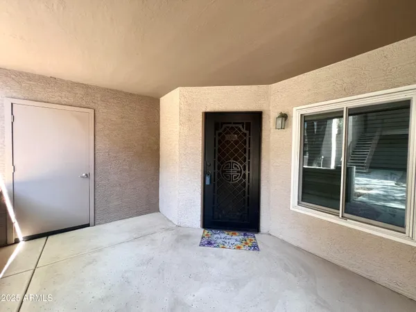 a view of an empty room with a window