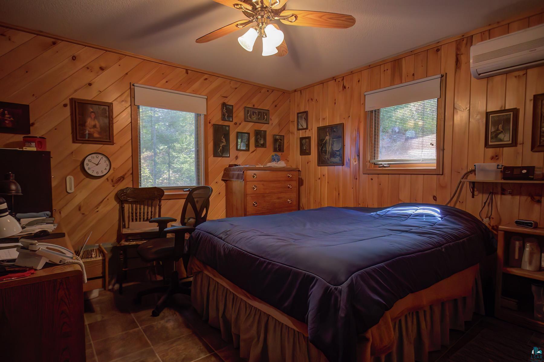 2811 Schaeffer Road Ely, MN 55731 - Photo 16 of 40 Wood-paneled walls and ceiling fan with integrated lighting
