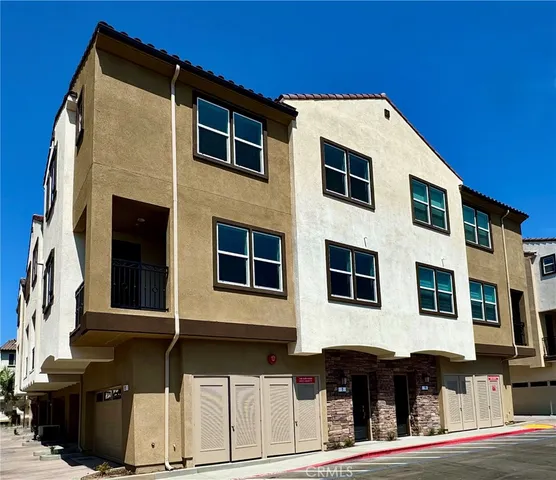 a front view of a house with glass windows