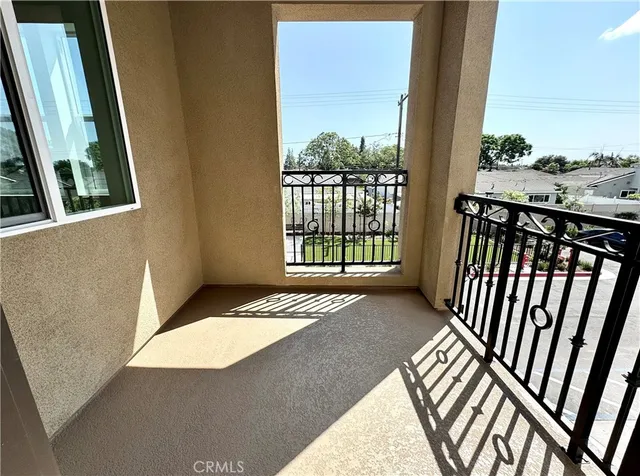 a view of balcony with wooden floor