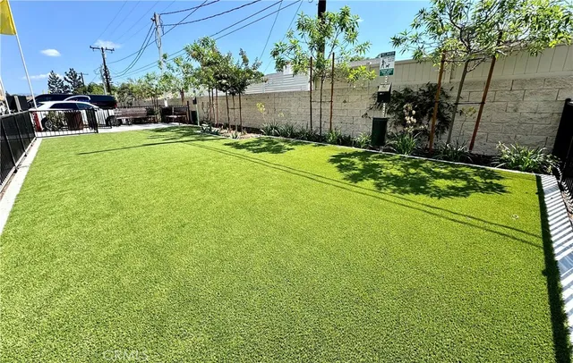 a view of a backyard with sitting area