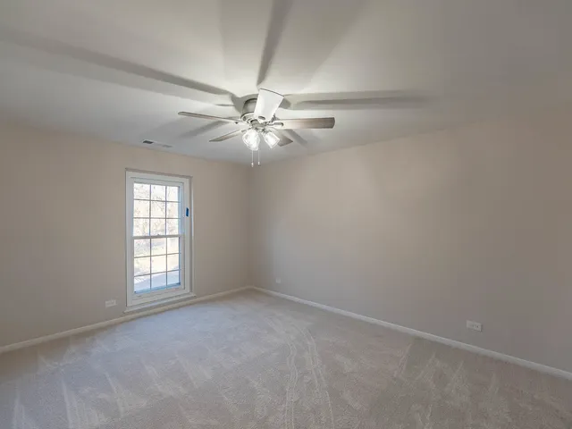 a bathroom with a toilet sink shower and mirror