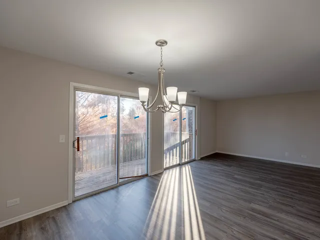 a kitchen with a refrigerator sink and cabinets