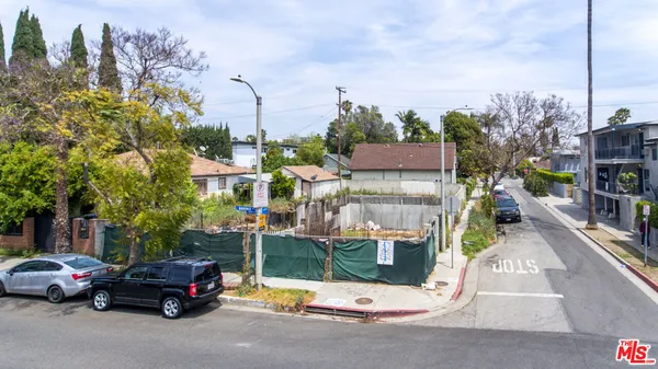 an aerial view of houses with outdoor space
