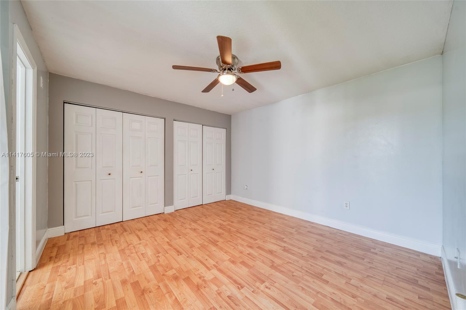 13440 Southwest 62nd Street, Unit G101 Miami, FL 33183 - Photo 17 of 25 a view of empty room with wooden floor