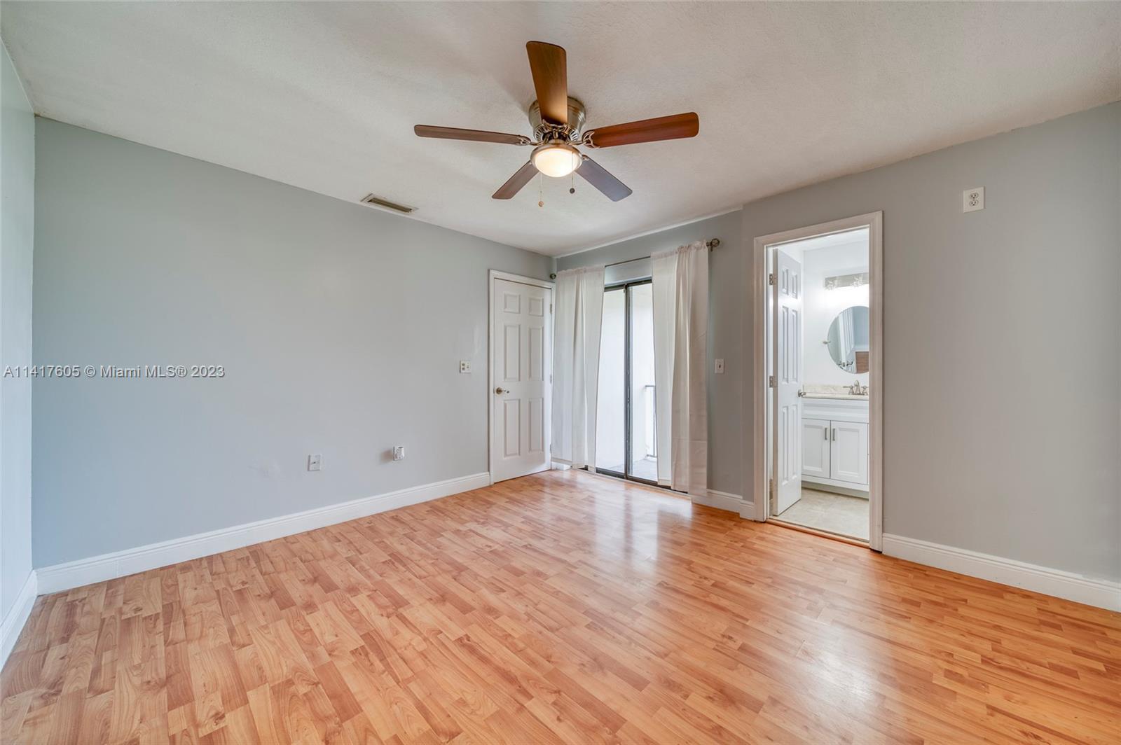 13440 Southwest 62nd Street, Unit G101 Miami, FL 33183 - Photo 18 of 25 a view of an empty room and wooden floor