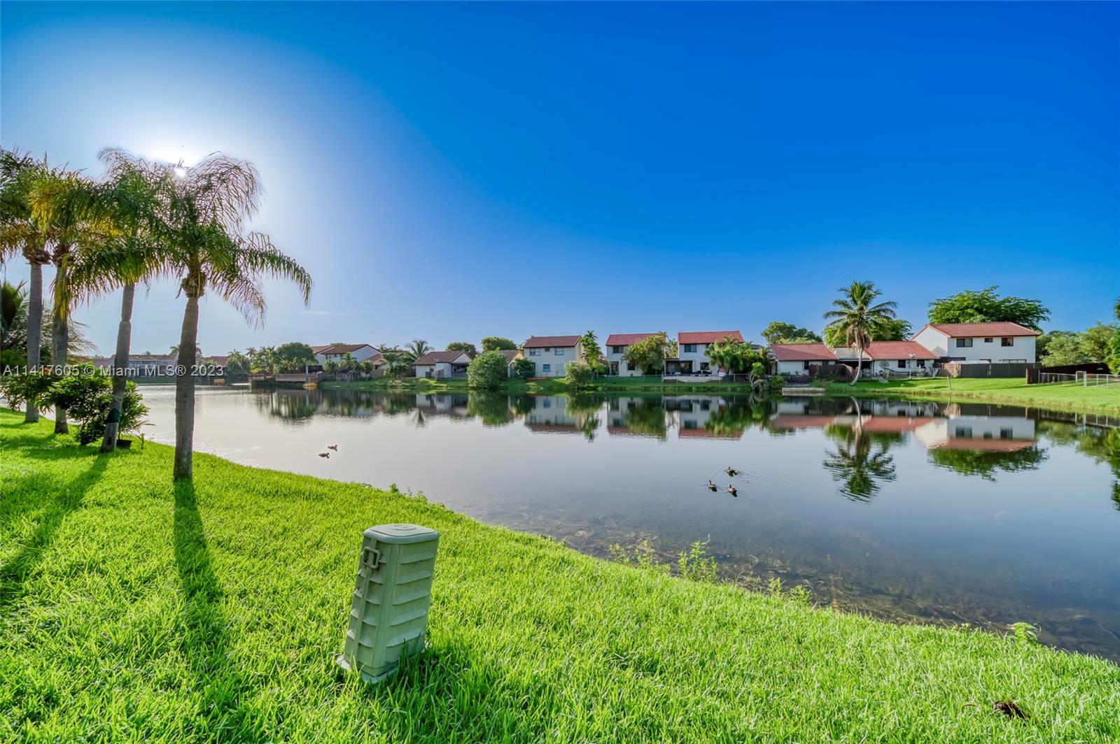13440 Southwest 62nd Street, Unit G101 Miami, FL 33183 - Photo 5 of 25 a view of lake with green space