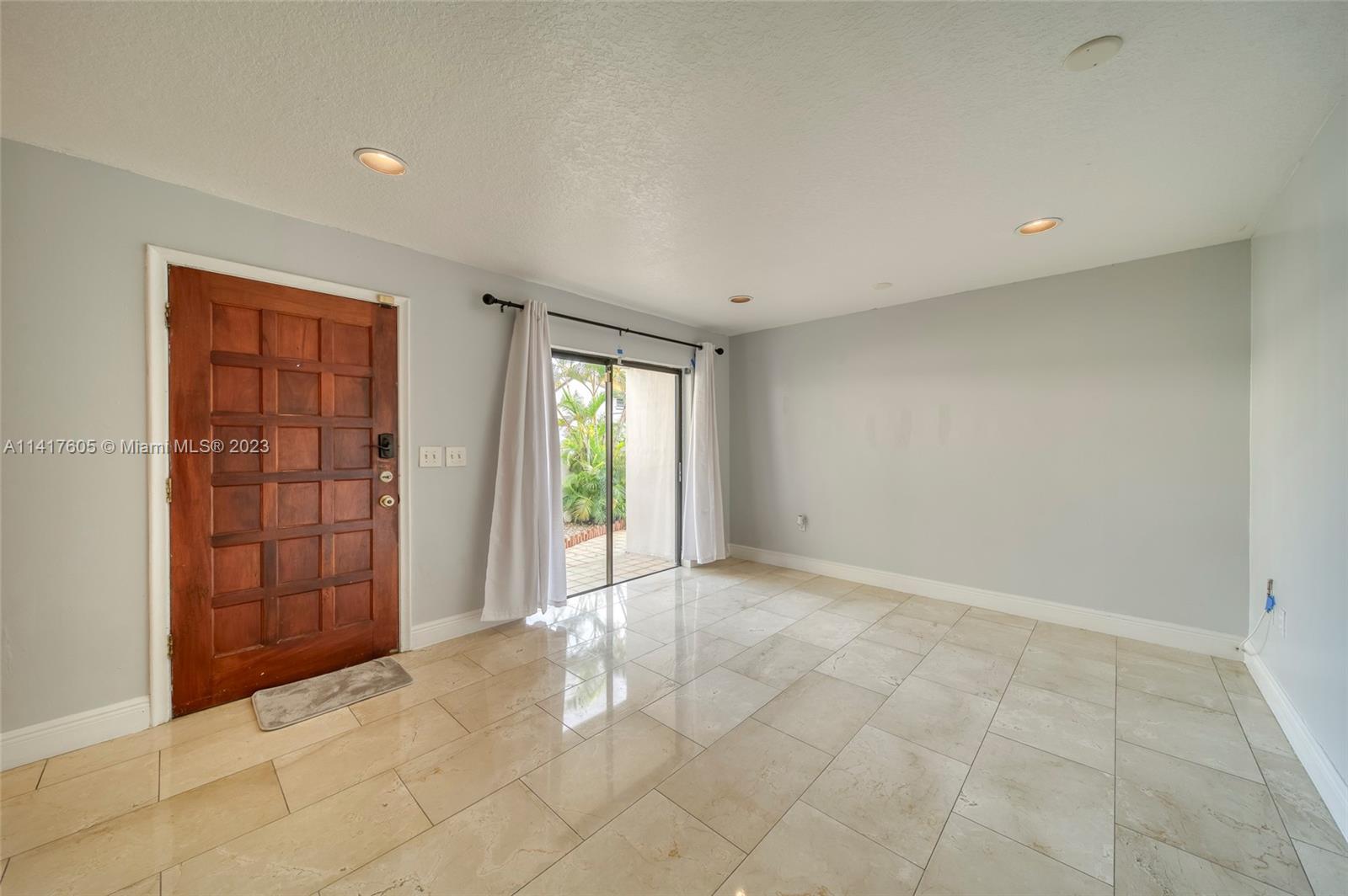 13440 Southwest 62nd Street, Unit G101 Miami, FL 33183 - Photo 7 of 25 a view of an empty room with a window