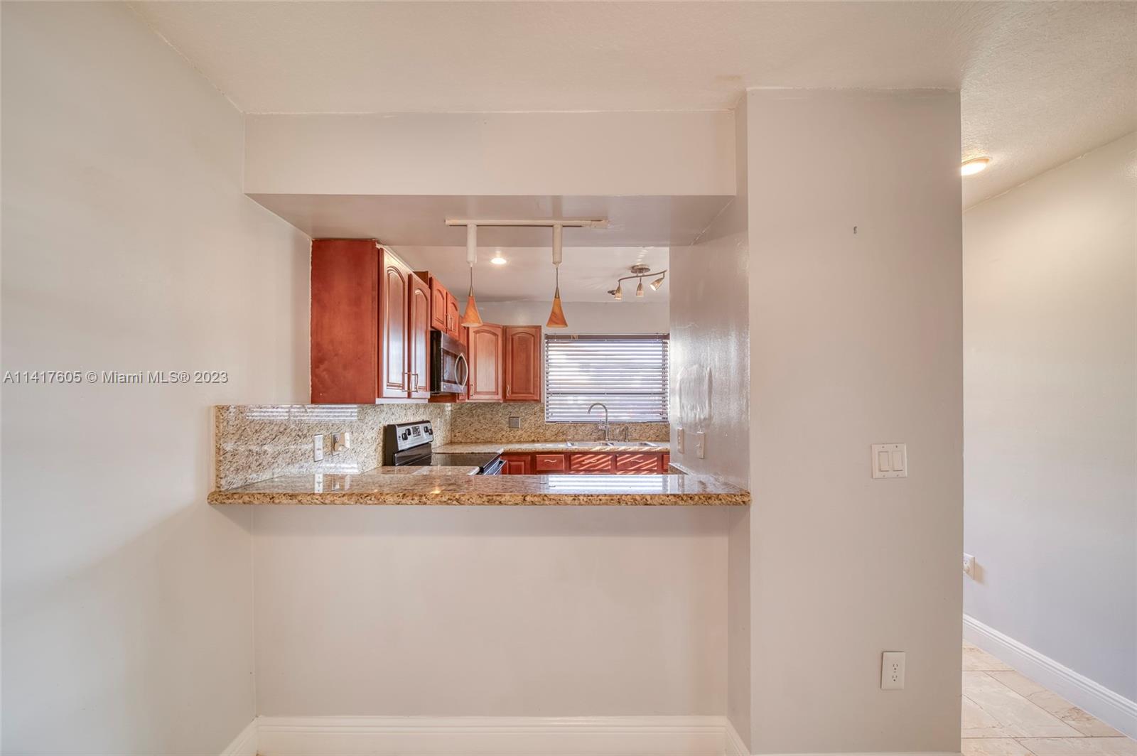13440 Southwest 62nd Street, Unit G101 Miami, FL 33183 - Photo 10 of 25 a bathroom with a sink and a mirror