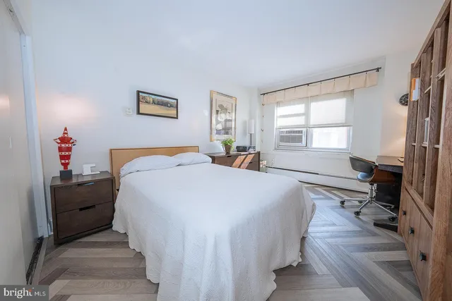 a bedroom with bed and window