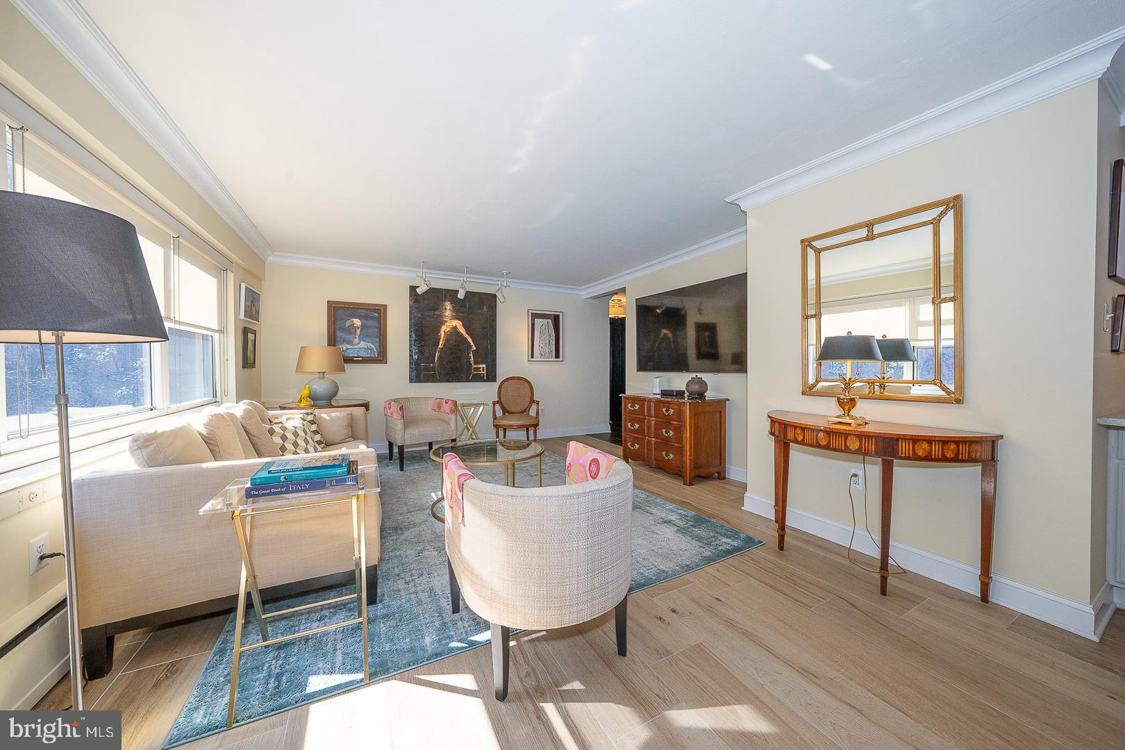 118 South 21st Street, Unit 31112 Philadelphia, PA 19103 - Photo 2 of 26 a living room with fireplace furniture and a wooden floor