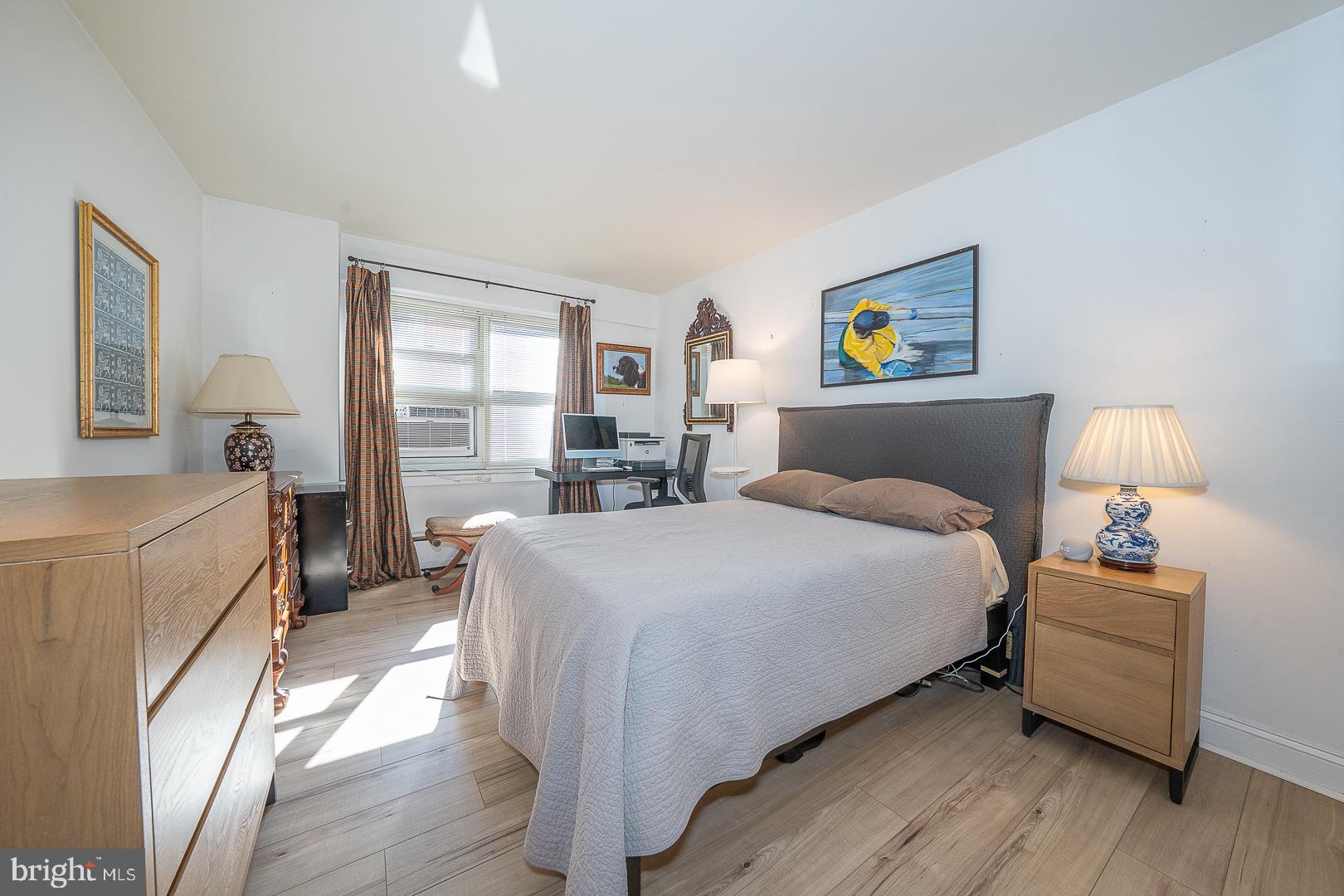 118 South 21st Street, Unit 31112 Philadelphia, PA 19103 - Photo 10 of 26 a bedroom with a bed and a large window