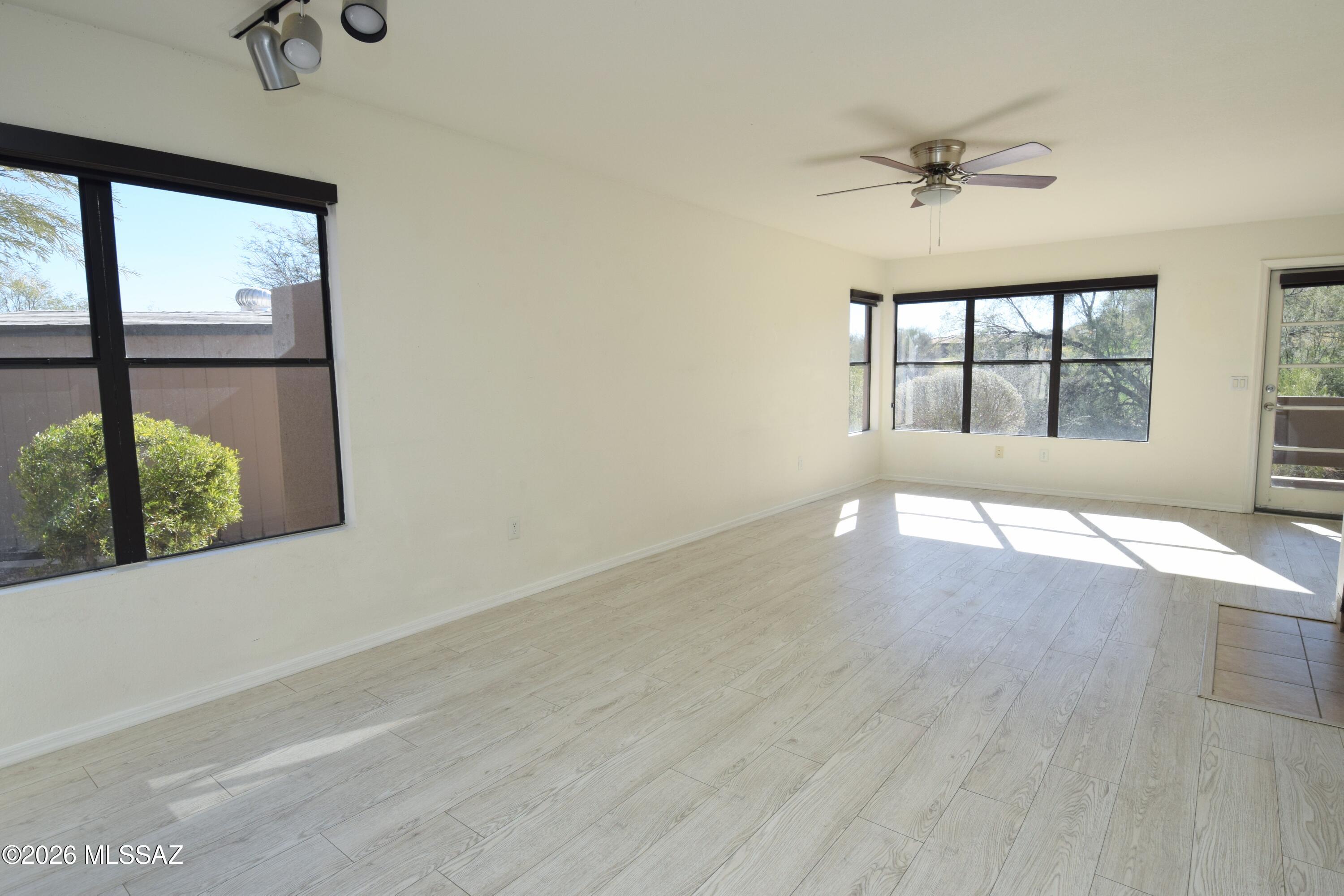 5855 North Kolb Road, Unit 11106 Tucson, AZ 85750 - Photo 4 of 36 wooden floor in an empty room with a window
