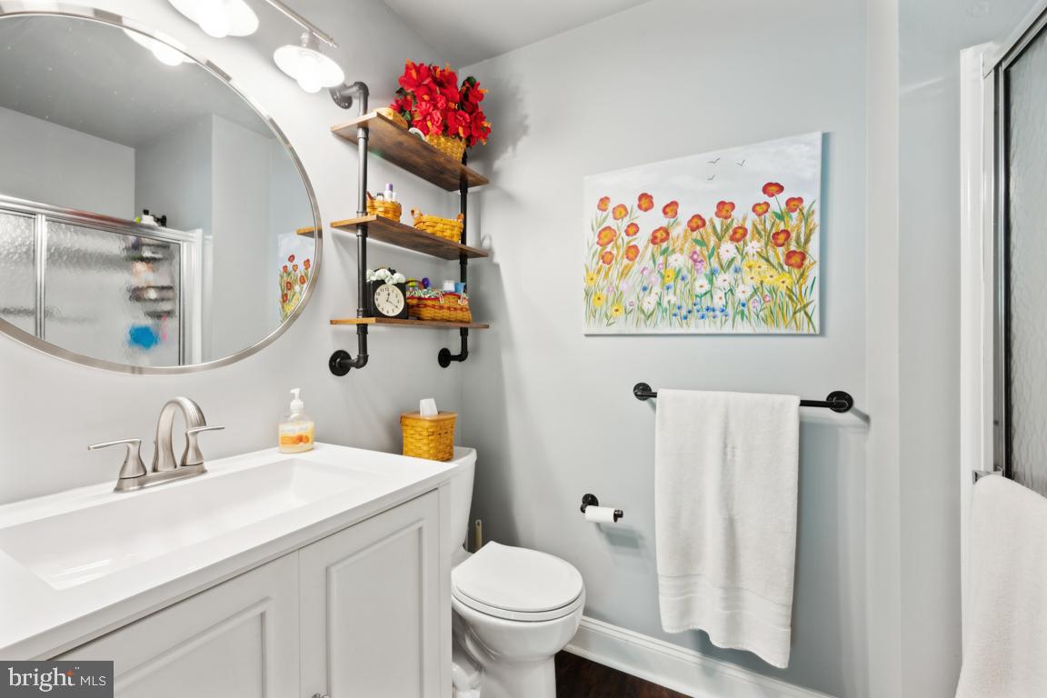 1009 Squirrel Road Marlton, NJ 08053 - Photo 19 of 29 a bathroom with a toilet sink and mirror