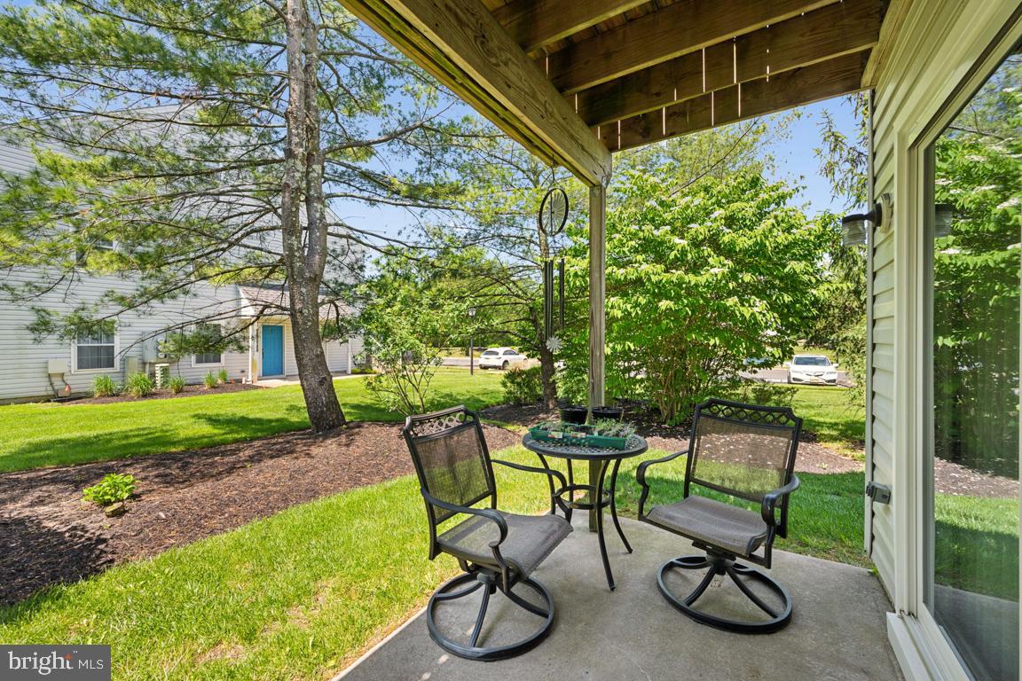 1009 Squirrel Road Marlton, NJ 08053 - Photo 21 of 29 a view of an chair and table in backyard of the house