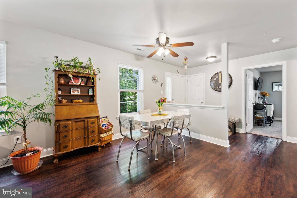 1009 Squirrel Road Marlton, NJ 08053 - Photo 7 of 29 a view of a dining room with furniture wooden floor and chandelier