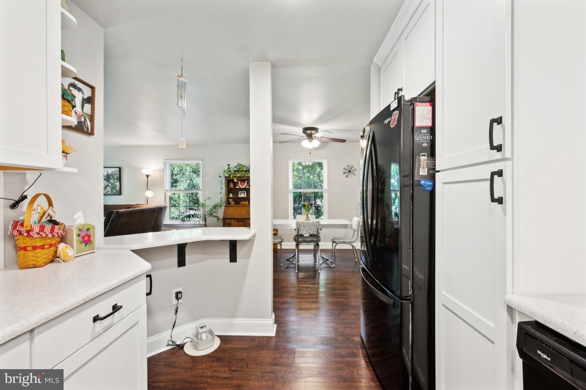 1009 Squirrel Road Marlton, NJ 08053 - Photo 8 of 29 a kitchen with a refrigerator and a stove top oven