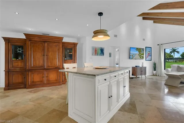a kitchen with stainless steel appliances granite countertop a sink and cabinets