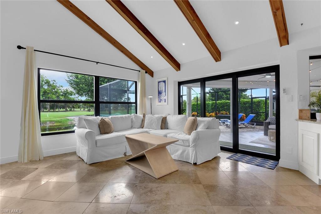 167 Torrey Pines Point Naples, FL 34113 - Photo 16 of 37 a living room with couch and a large window