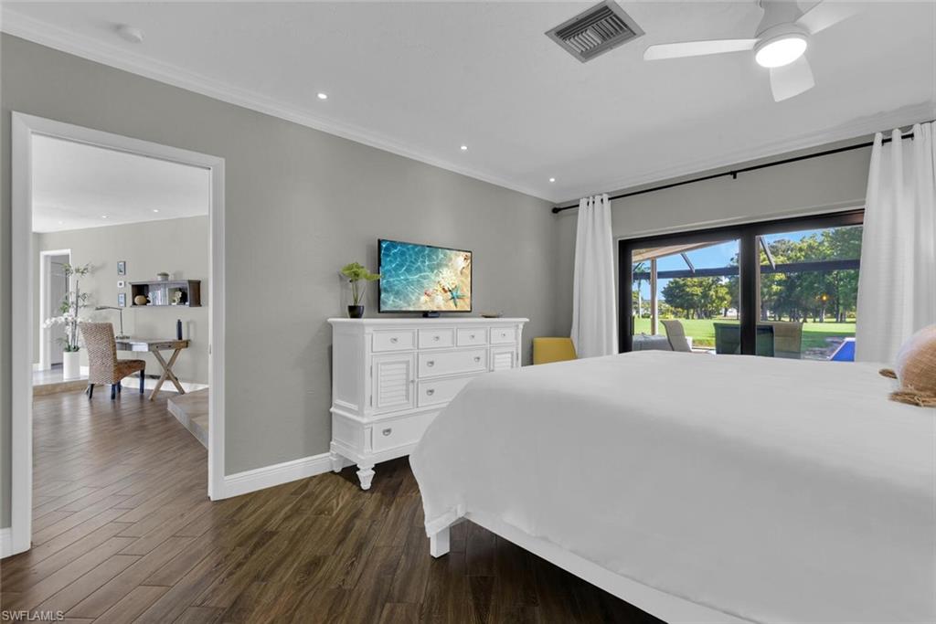 167 Torrey Pines Point Naples, FL 34113 - Photo 19 of 37 a room with a bed and a large window