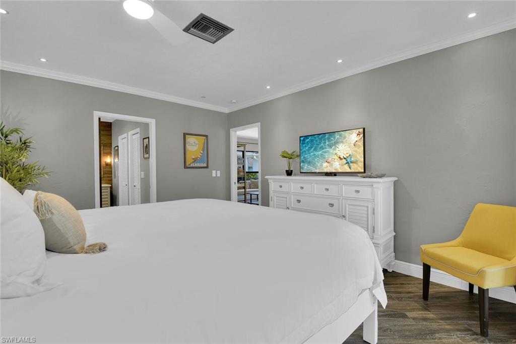 167 Torrey Pines Point Naples, FL 34113 - Photo 20 of 37 a bedroom with a bed and a chair