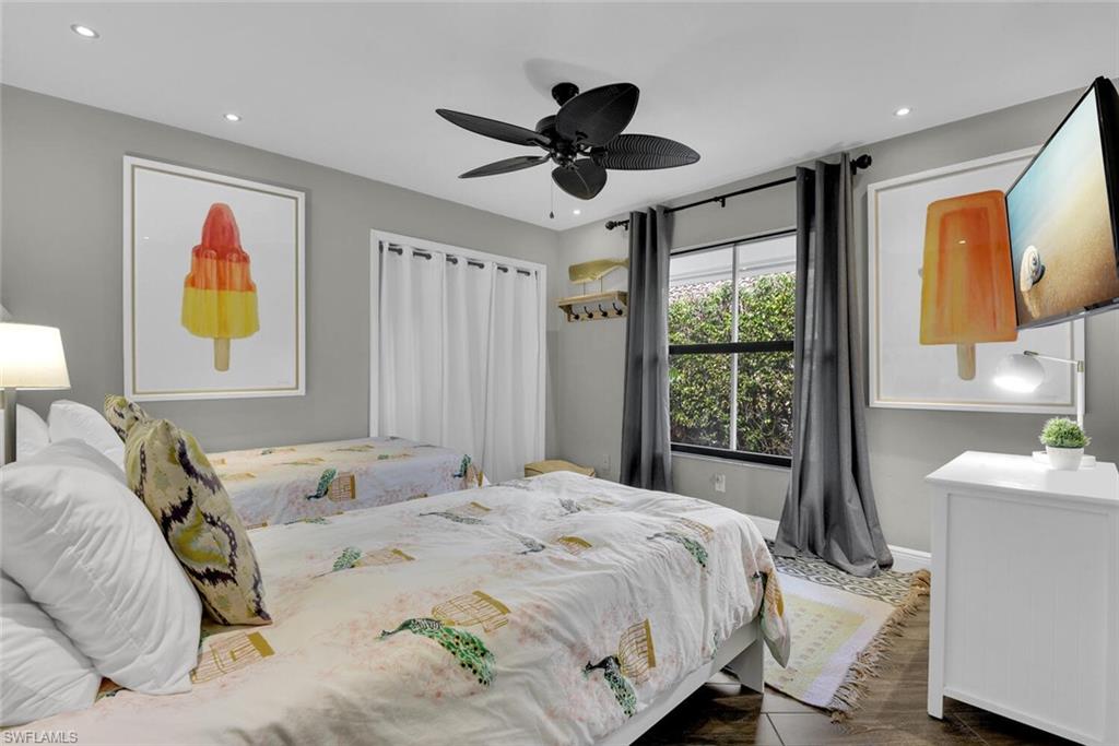 167 Torrey Pines Point Naples, FL 34113 - Photo 24 of 37 a bedroom with a bed and a large window