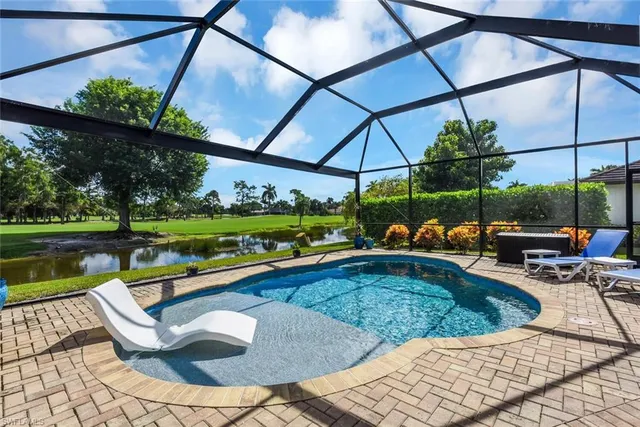 a view of a swimming pool with a patio