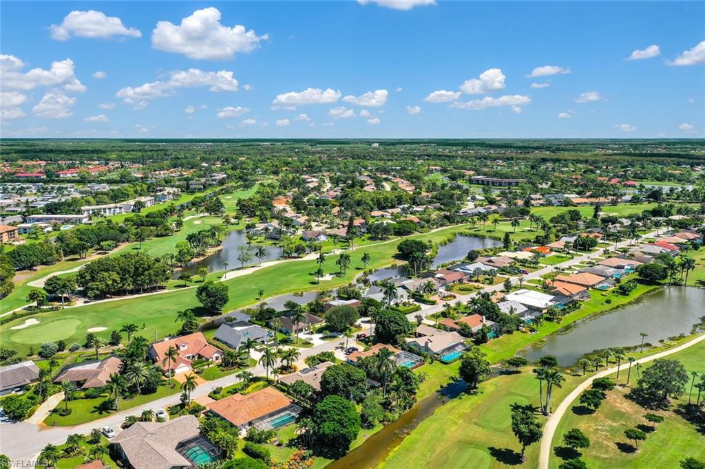 167 Torrey Pines Point Naples, FL 34113 - Photo 36 of 37 an aerial view of a houses with a yard