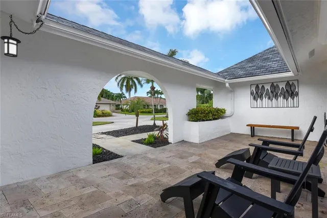 a view of a livingroom with furniture and a potted plant