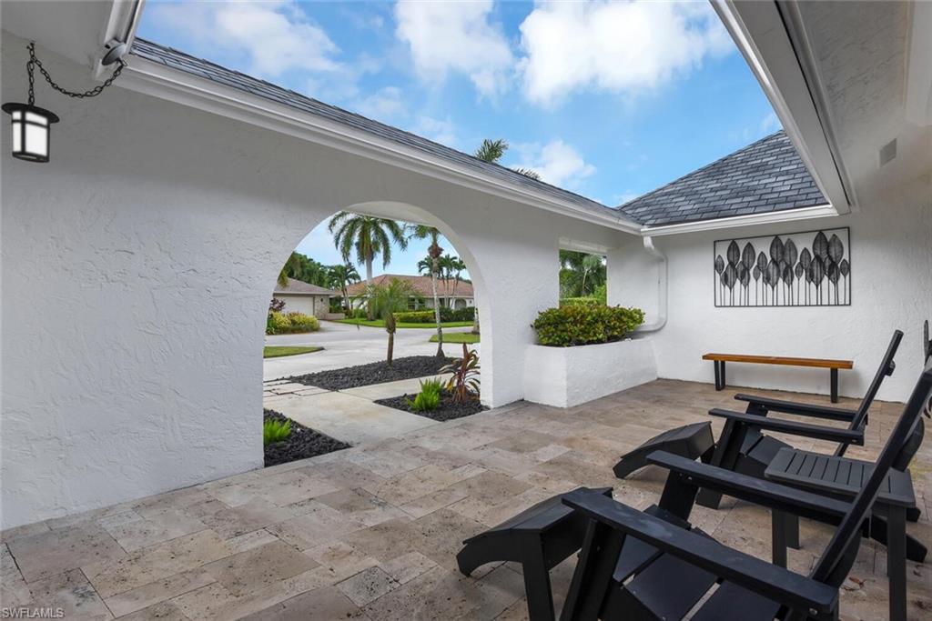 167 Torrey Pines Point Naples, FL 34113 - Photo 4 of 37 a view of a livingroom with furniture and a potted plant