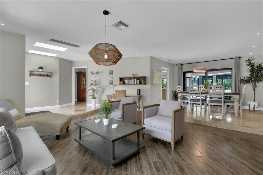 167 Torrey Pines Point Naples, FL 34113 - Photo 8 of 37 a living room with furniture and wooden floor