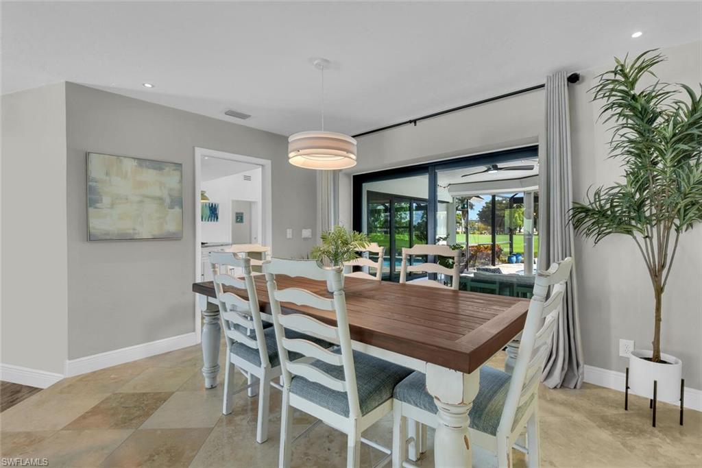 167 Torrey Pines Point Naples, FL 34113 - Photo 9 of 37 a view of a dining room with furniture window and wooden floor
