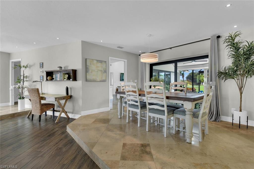 167 Torrey Pines Point Naples, FL 34113 - Photo 10 of 37 a dining room with furniture potted plants and wooden floor